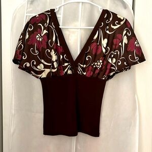 This is a medium, faux Silk, v-neck blouse
